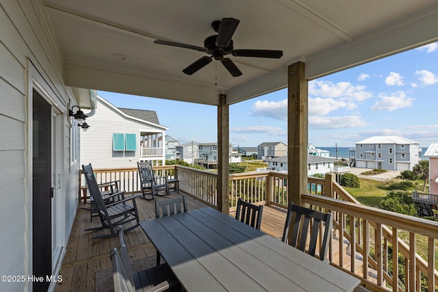 deck featuring a water view and ceiling fan