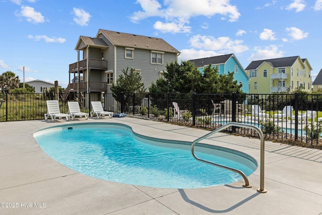 view of swimming pool with a patio area