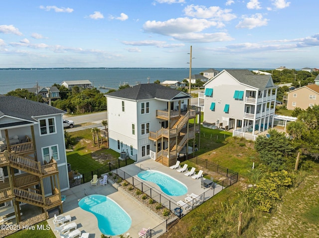 birds eye view of property with a water view