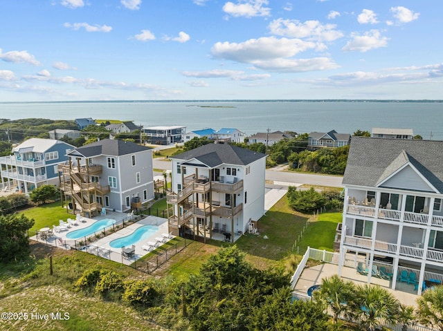 birds eye view of property with a water view