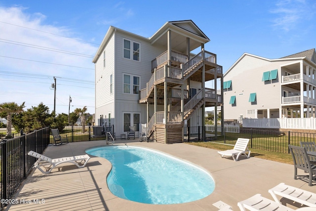 1903 Emerald Dr, Emerald Isle, NC 28594 - back of house featuring stairway, fence, a patio, and a balcony
