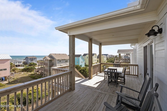 1903 Emerald Dr, Emerald Isle, NC 28594 - wooden deck featuring outdoor dining space and a residential view