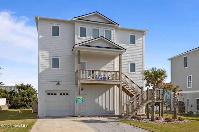 1903 Emerald Dr, Emerald Isle, NC 28594 - raised beach house with a garage, driveway, stairs, and a front yard