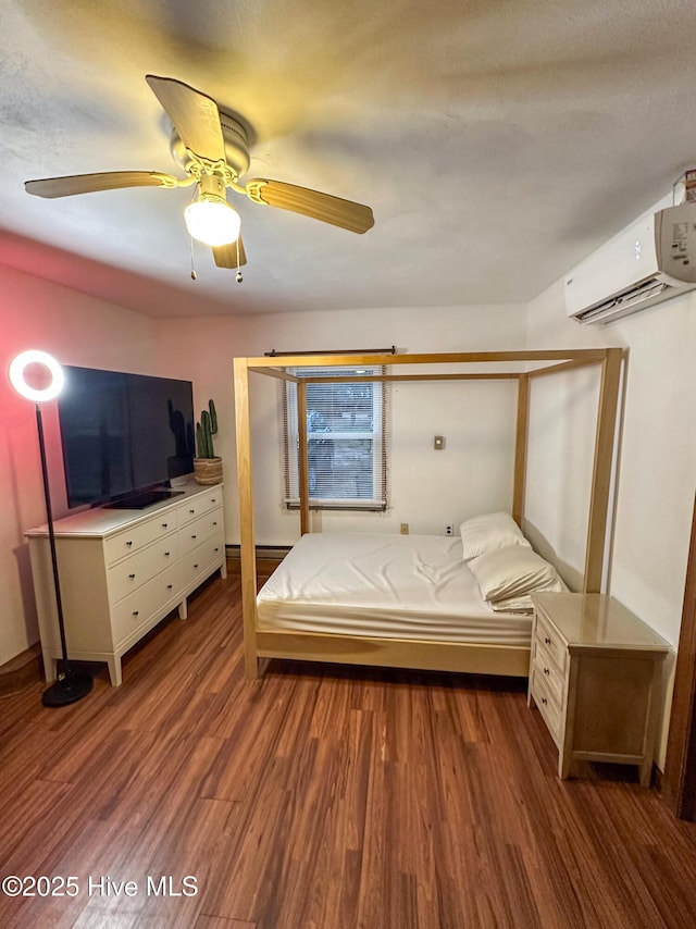 unfurnished bedroom with dark hardwood / wood-style flooring, a wall unit AC, and ceiling fan