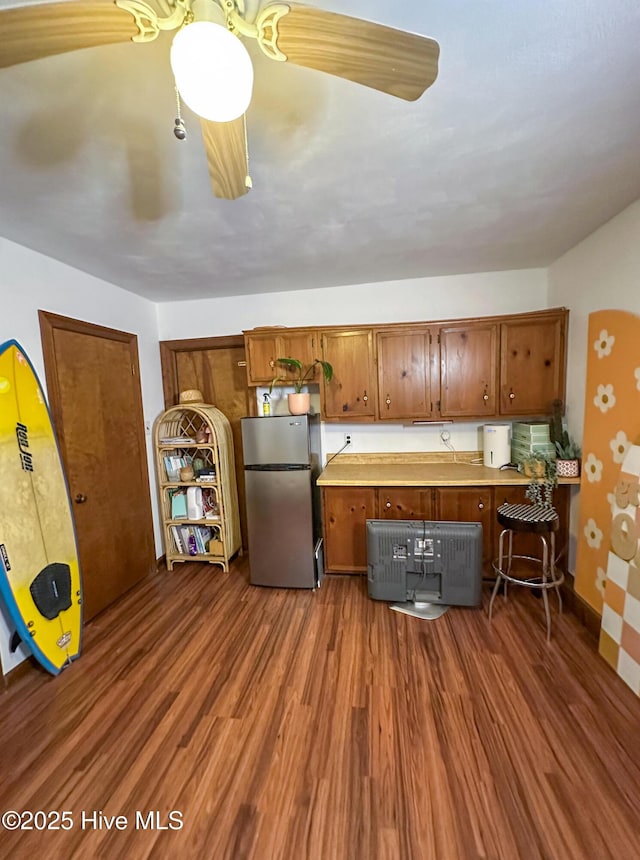 kitchen featuring dark wood-type flooring and stainless steel refrigerator