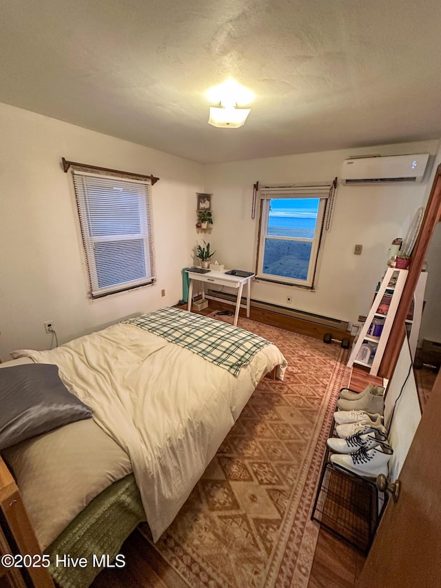 bedroom with an AC wall unit