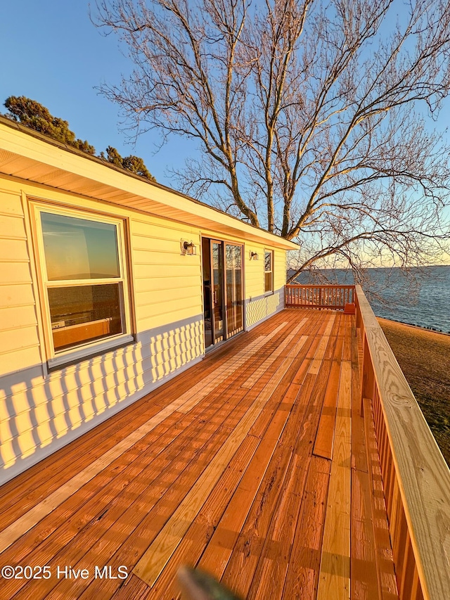 wooden deck with a water view