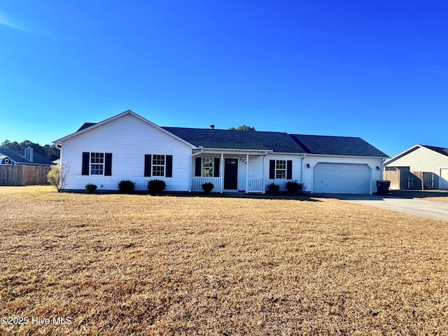 ranch-style home featuring a garage and a front yard