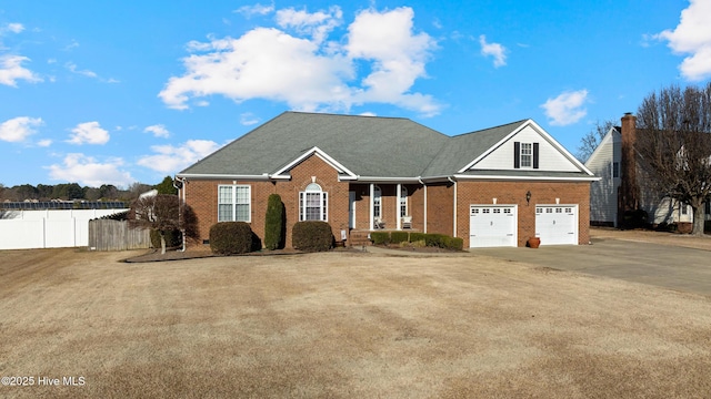 front facade featuring a garage and a front lawn