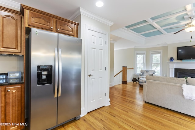 kitchen with crown molding, coffered ceiling, stainless steel fridge, and light wood-type flooring