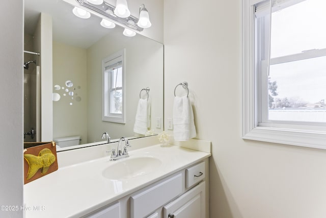 bathroom featuring vanity and toilet