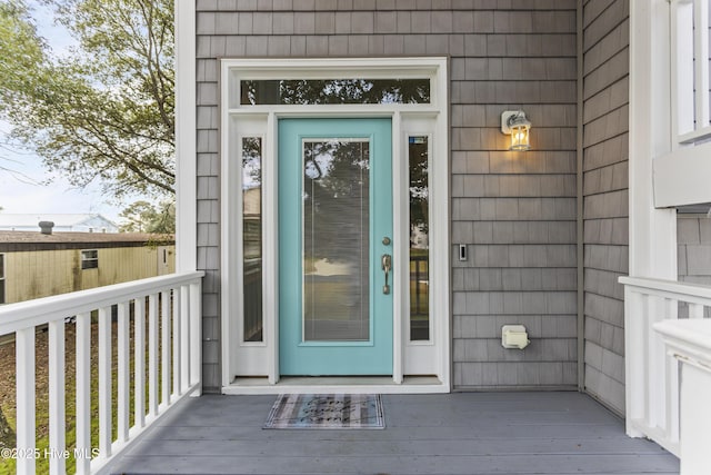 doorway to property with a deck