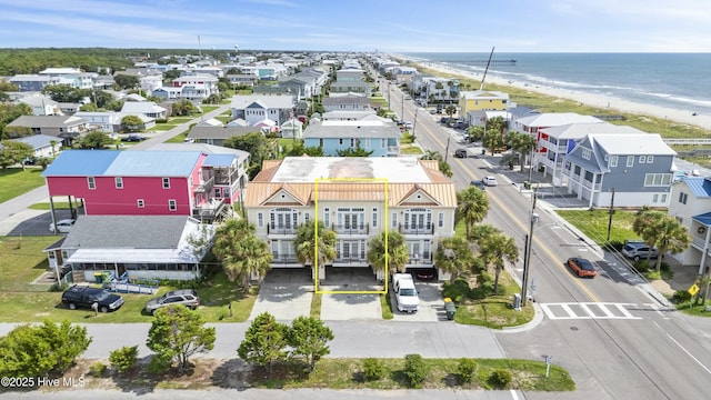 aerial view featuring a water view and a view of the beach