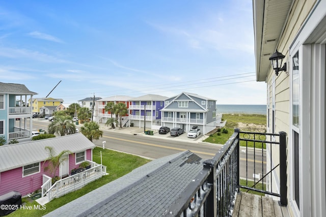 balcony featuring a water view