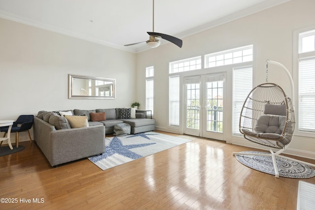 living room featuring crown molding, ceiling fan, and hardwood / wood-style flooring