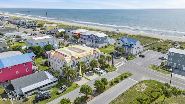 bird's eye view with a water view and a view of the beach