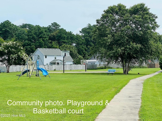 exterior space with a yard and a playground