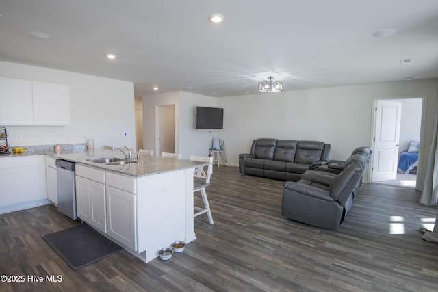 kitchen with dishwasher, sink, dark wood-type flooring, and white cabinets