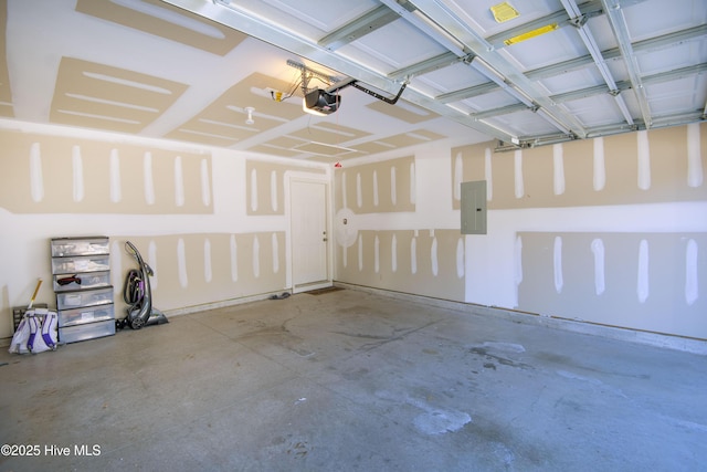 garage featuring a garage door opener and electric panel