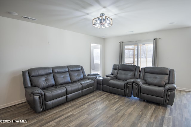 living room with dark hardwood / wood-style flooring