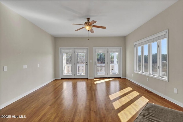 spare room featuring hardwood / wood-style flooring and ceiling fan