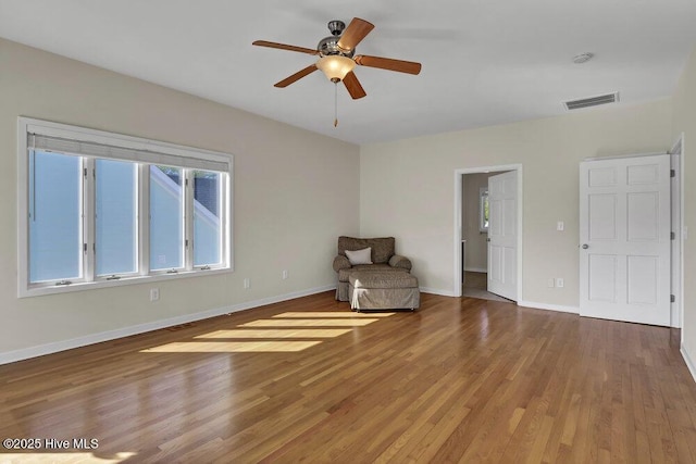 unfurnished room featuring hardwood / wood-style floors and ceiling fan