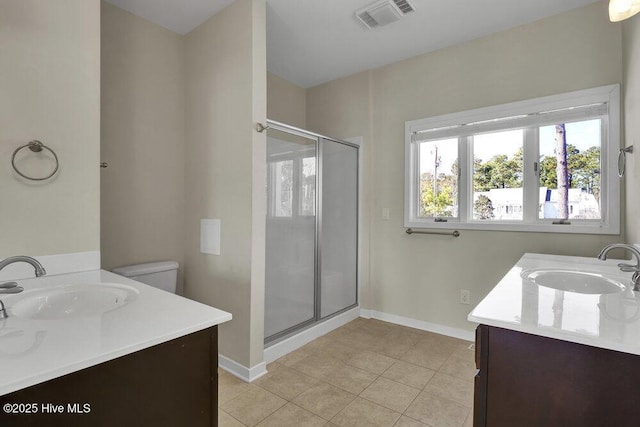 bathroom with vanity, an enclosed shower, tile patterned floors, and toilet