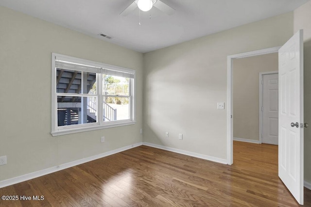 unfurnished room featuring ceiling fan and wood-type flooring