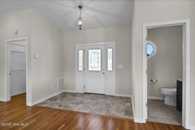 foyer with wood-type flooring