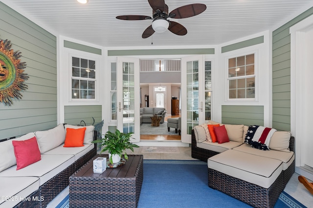 sunroom with ceiling fan and french doors