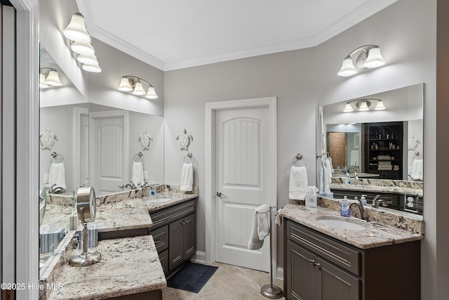 bathroom featuring ornamental molding and vanity