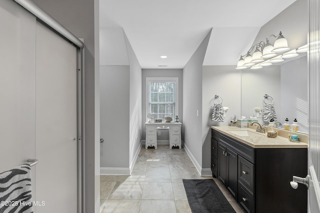 bathroom with marble finish floor, visible vents, vanity, and baseboards