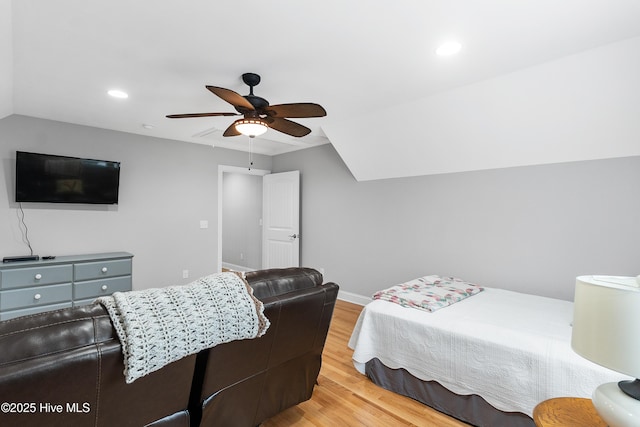 bedroom with lofted ceiling, light wood-type flooring, a ceiling fan, and recessed lighting