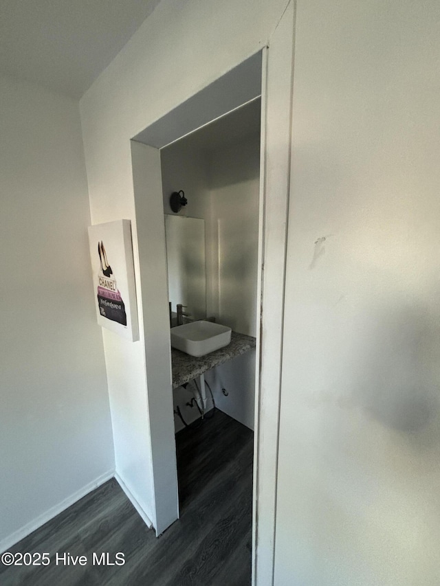 hall with sink and dark hardwood / wood-style floors