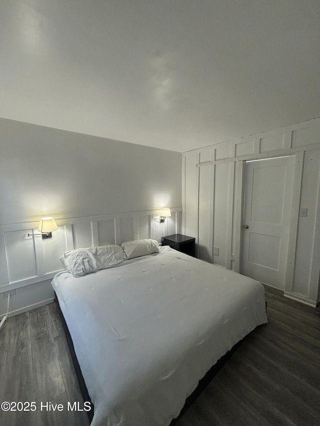 bedroom featuring dark hardwood / wood-style flooring