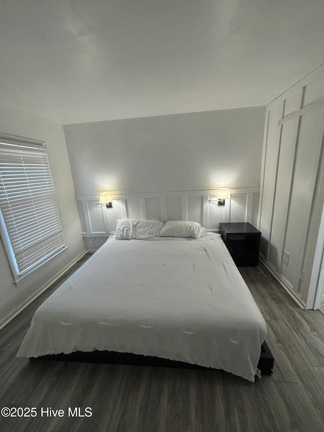 bedroom featuring dark hardwood / wood-style floors