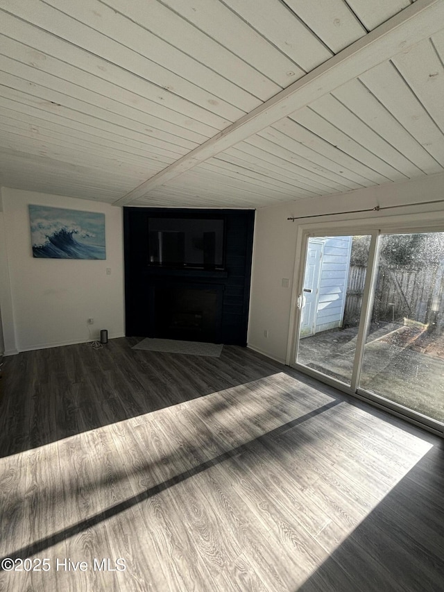 unfurnished living room featuring wood ceiling, wood-type flooring, and beam ceiling