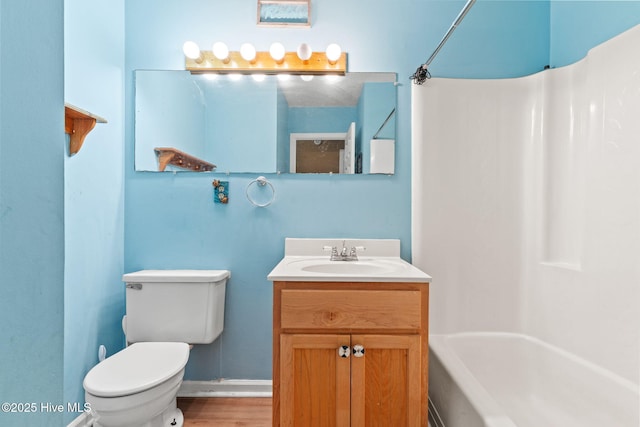 full bathroom featuring vanity, tub / shower combination, and toilet