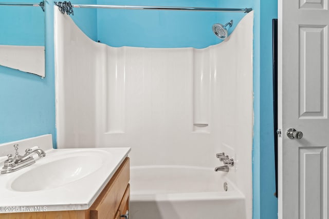 bathroom with vanity and washtub / shower combination