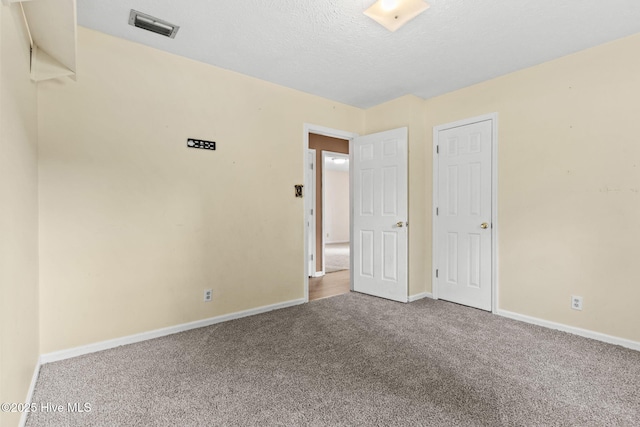 empty room with carpet flooring