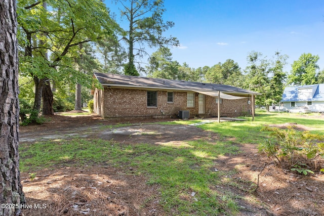 back of house featuring central AC unit