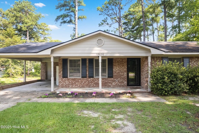 ranch-style home with a carport, a porch, and a front yard