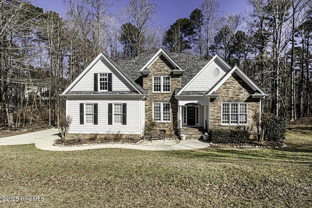 view of front facade featuring stone siding and a front lawn