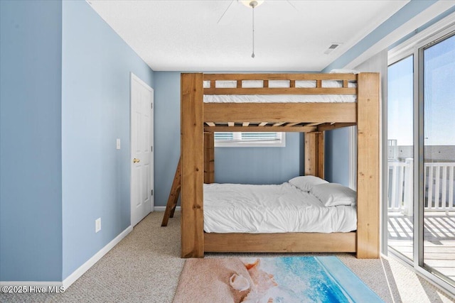 carpeted bedroom featuring access to outside