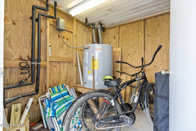 utility room featuring electric water heater