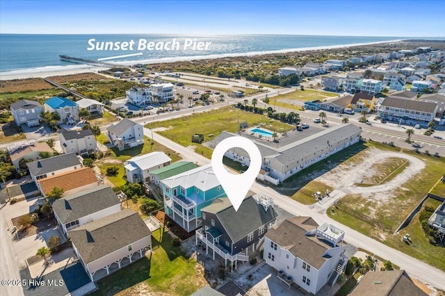 aerial view with a view of the beach and a water view