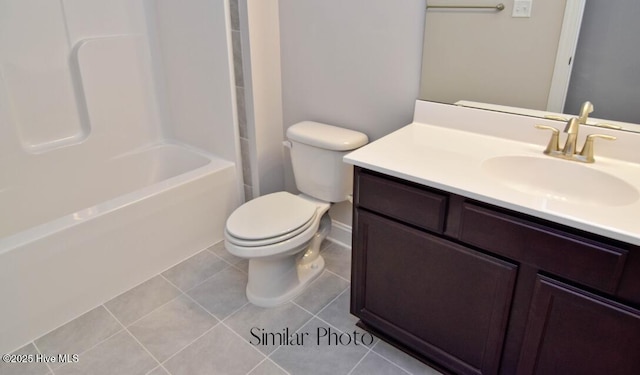 full bathroom featuring vanity, bathing tub / shower combination, tile patterned floors, and toilet