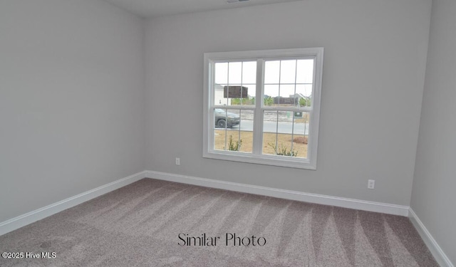 spare room with carpet flooring