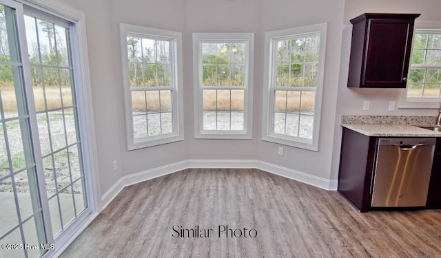 unfurnished dining area with light hardwood / wood-style flooring