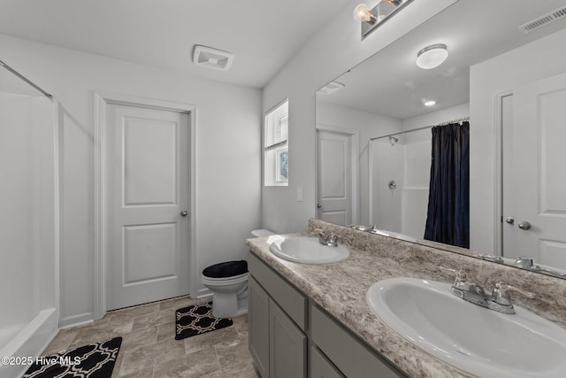 bathroom with toilet, a shower with curtain, and vanity